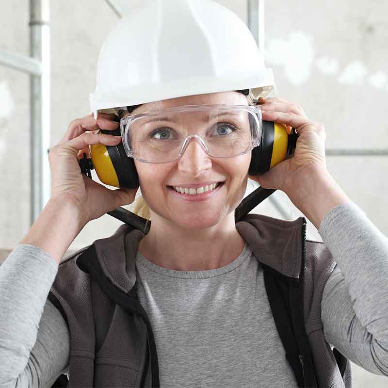 Woman putting on hearing protection